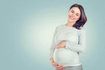 Pregnant happy woman touching her belly. Pregnant middle aged woman portrait. Healthy pregnancy concept