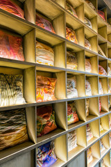 Pillows on shelves with lighting. Sale of pillows in the store. The original design of the restaurant.