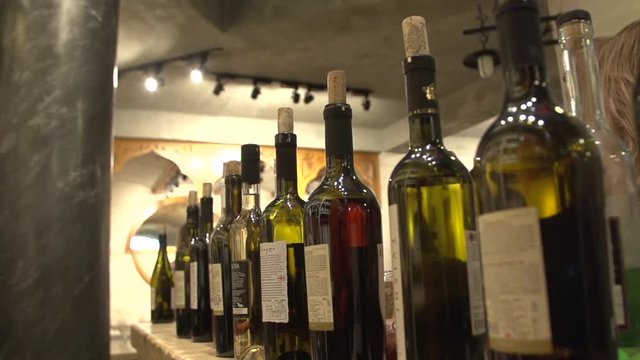 Many bottles of wine slow motion shot
