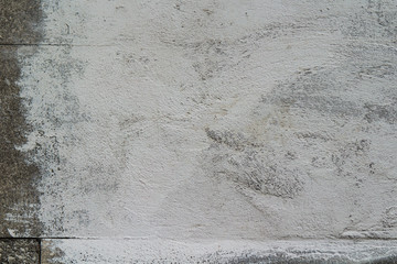 wall with a patch of white paint for the text