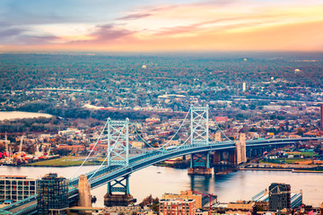 Aerial view of Ben Franklin bridge spanning Delaware river, in Philadelphia
