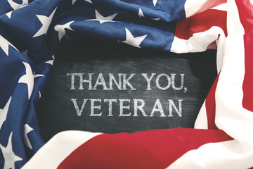 Obraz na płótnie Canvas Handwriting of thank you, veteran with American flag