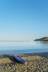 Empty kayak on the coastline