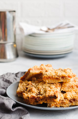 Apricot jam streusel pie on gray plate