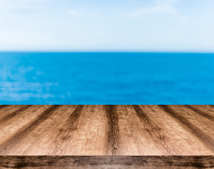 Wooden empty table board in front of blurred background. Can be used for display or montage any product. Mock up for display your product.