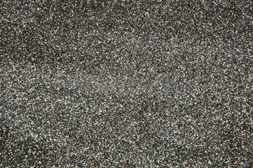 Black sand formed from the volcano and starfish for the texture,background and empty space for the text.
Beach sand in Greece