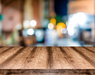 Wooden empty table board in front of blurred background. Can be used for display or montage any product. Mock up for display your product.