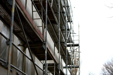 Steel scaffolding placed outside the high building for its renewal.