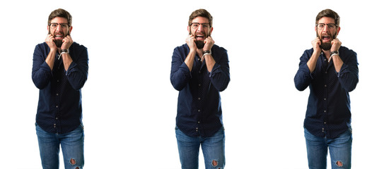 Young man with beard happy and surprised cheering expressing wow gesture isolated over white background