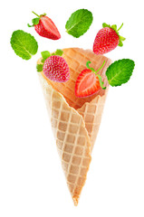 Waffle cones with flying strawberries and mint leaves