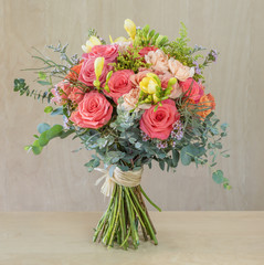 bouquet of flowers, multi-colored roses with green leaves
