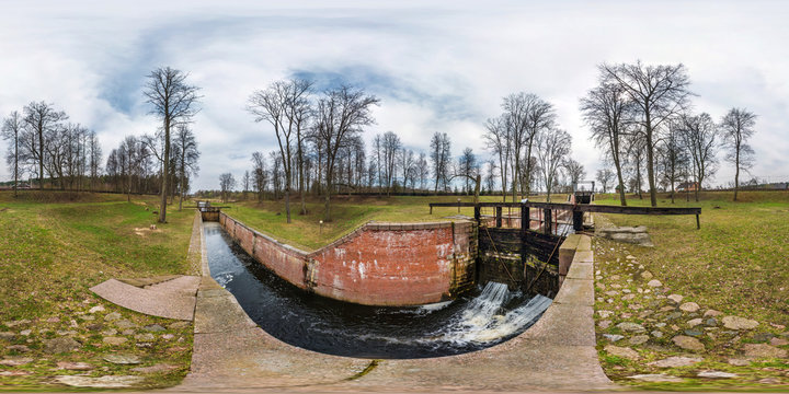panorama 360 angle view near canal for passing vessels at different water levels.  gateway lock sluice construction on river. Full spherical 360 degrees seamless panorama in equirectangular projection