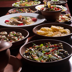 Assorted oriental food set. Armenian,Georgian cuisine dishes on table.Food party.
