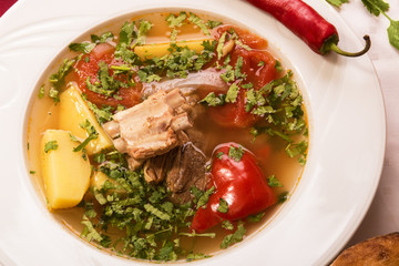 soup shurpa lamb ribs in a white plate