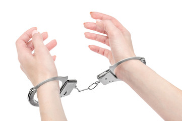 Woman's hands in handcuffs. Isolated on white.