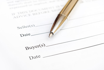 Pen on the contract. Close up. Ready for signature.