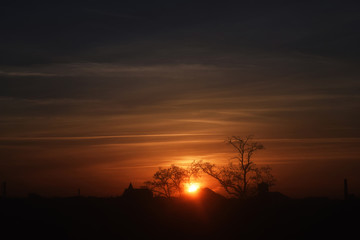 Fototapeta na wymiar Natural Sunset Sunrise Over Field Or Meadow.