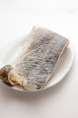 Slice of raw salted codfish