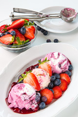 Summer theme. fruit ice cream with fresh fruit in light key on white background