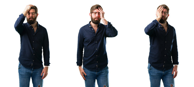 Young man with beard stressful keeping hand on head, tired and frustrated isolated over white background