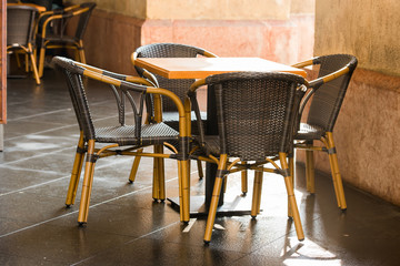 outdoor wicker furniture in cafes, chairs and tables