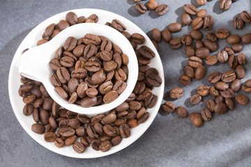 Roasted coffee on the wooden background - Coffea