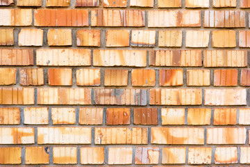 Lugazi, 1 May 2017. Red bricks in layers as a cladding of a wall.