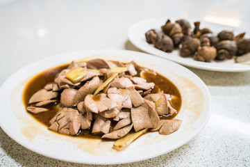 A plate of stir fry pig kidney with ginger and wine.