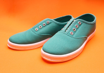 Green Sneakers on Orange