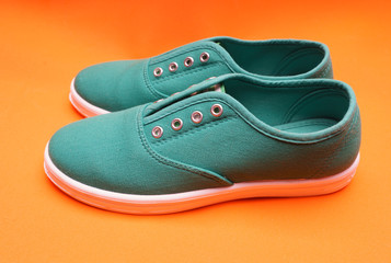 Green Sneakers on Orange