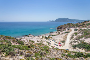 Beautiful sunny coast view to the greek mediterranean blue sea with crystal clear water and pure...