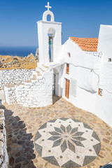 Holy greek chruch agios sant michael orthodox chapel monastery shining above the village Emporios...