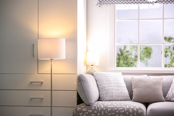 Stylish living room interior with floor lamp