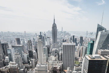 Fototapeta na wymiar View from rockefeller center plattform over big apple new york city at a light cloudy day with blue sky, New York City, New York/ USA - August-21-2017