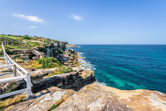 Sunny beautiful summer coast view to Sydney beach and blue Tasman Sea wild wave water and sandy white beaches perfect for surfing swimming hiking, Coogee to Bondi Walk, NSW/ Australia - 10 11 2017
