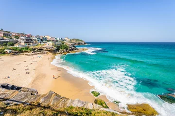 Poster Sunny beautiful summer coast view to Sydney beach and blue Tasman Sea wild wave water and sandy white beaches perfect for surfing swimming hiking, Coogee to Bondi Walk, NSW/ Australia - 10 11 2017 © Thomas Jastram
