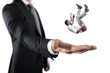 Businessman is saved from a big hand. Concept of business support and assistance