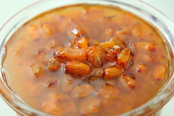 Fresh sea-buckthorn jam in a glass bowl. Close-up.