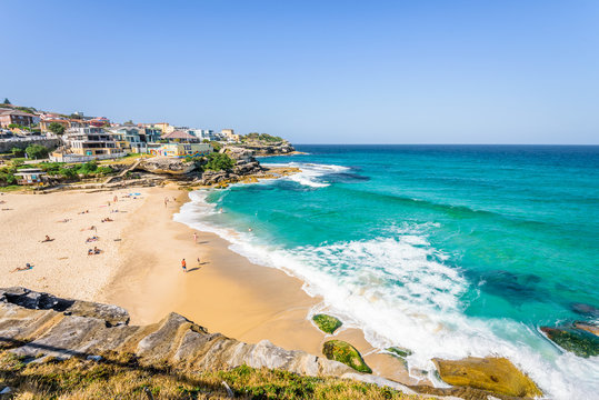 Sunny beautiful summer coast view to Sydney beach and blue Tasman Sea wild wave water and sandy white beaches perfect for surfing swimming hiking, Coogee to Bondi Walk, NSW/ Australia - 10 11 2017