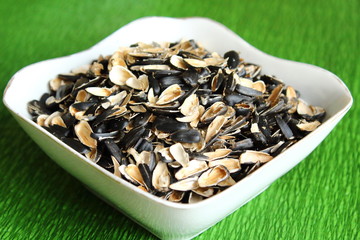 Shelk. Sunflower seeds in a plate. Close-up.
