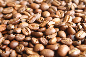 Coffee natural fried in arabica beans. Close-up. Background.