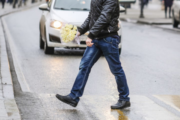 pedestrian crosses the road