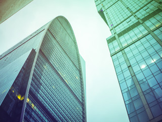 close up tall urban skyscrappers against the sky background