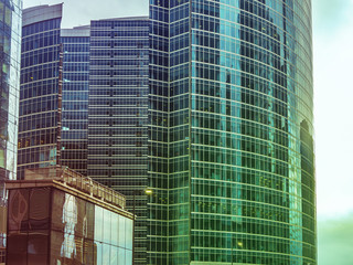 close up tall urban skyscrappers against the sky background