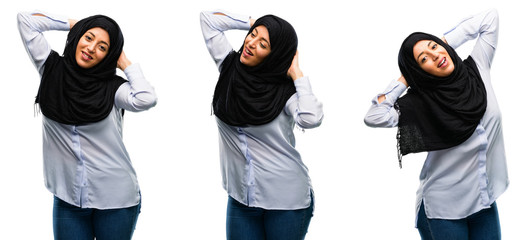 Arab woman wearing hijab confident and happy with a big natural smile laughing isolated over white background