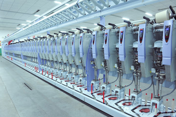 Fototapeta premium Machinery and equipment in a spinning production company