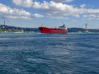 Fototapeta premium Cargo ship going to the destination from the bosphorus sea