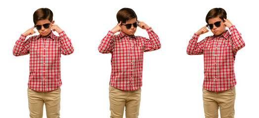 Handsome toddler child with green eyes doubt expression, confuse and wonder concept, uncertain...