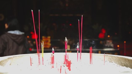 JAKARTA - Indonesia. April 17, 2018: Closeup of burned incense sticks on the pot in the Buddhist temple on Chinese New Year celebration at Glodok, Jakarta, Indonesia