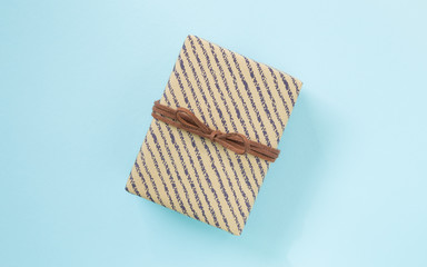 Gift on simple color paper background